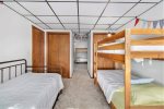 The two bunk rooms have an open pathway between then